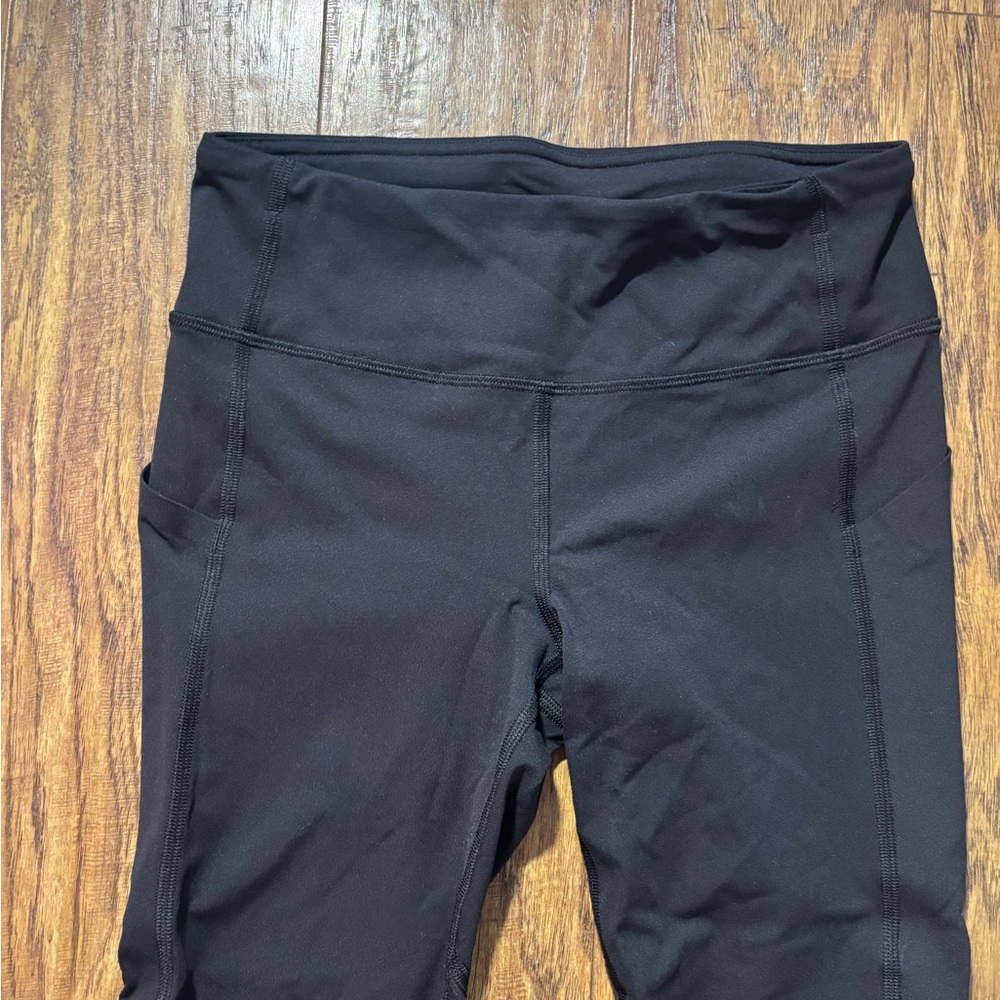Lulu lemon Black High-Waisted running leggings.